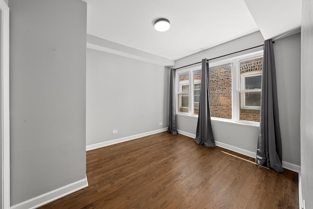 4604 N Monticello Ave Unit 3E, Chicago, IL 60625 - spare room featuring dark wood-type flooring and baseboards