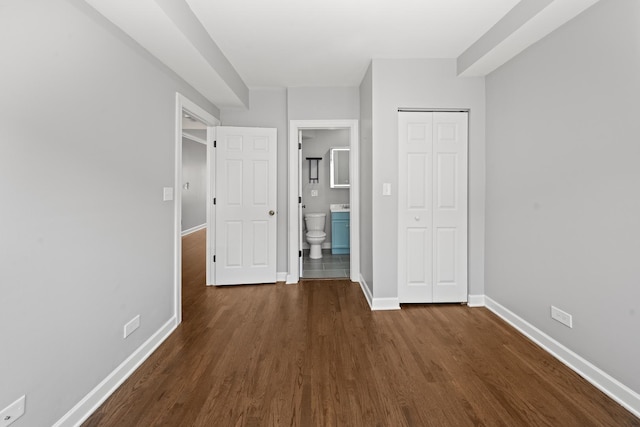 4604 N Monticello Ave Unit 3E, Chicago, IL 60625 - unfurnished bedroom featuring dark wood-style flooring, a closet, and ensuite bath