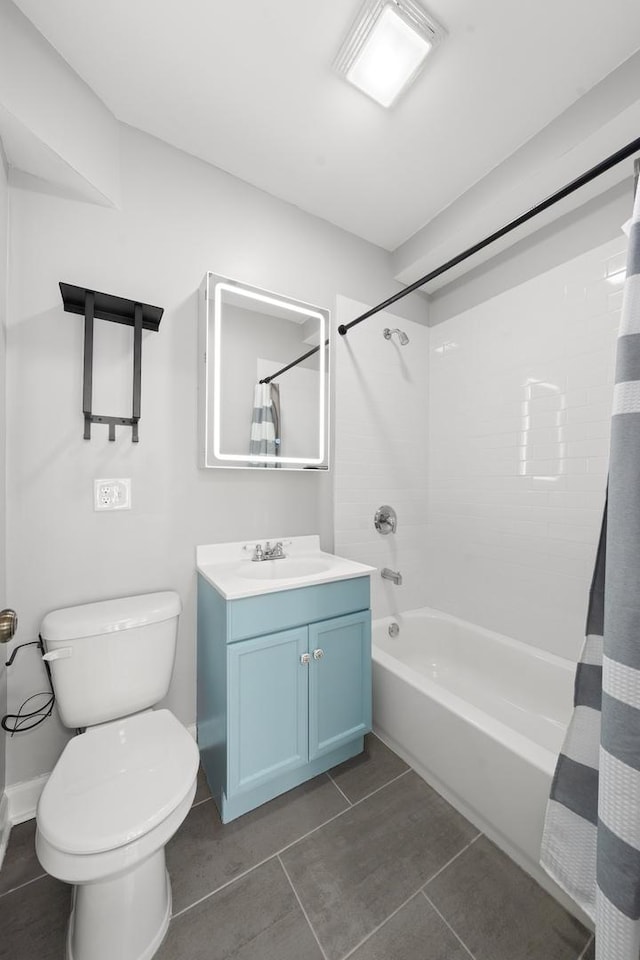 4604 N Monticello Ave Unit 3E, Chicago, IL 60625 - bathroom featuring vanity, shower / tub combo, and tile patterned floors