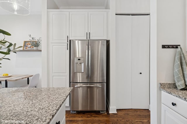 1401 N Wieland St Unit P, Chicago, IL 60610 - kitchen featuring stainless steel refrigerator with ice dispenser, light stone counters, white cabinets, dark wood-type flooring, and ornamental molding