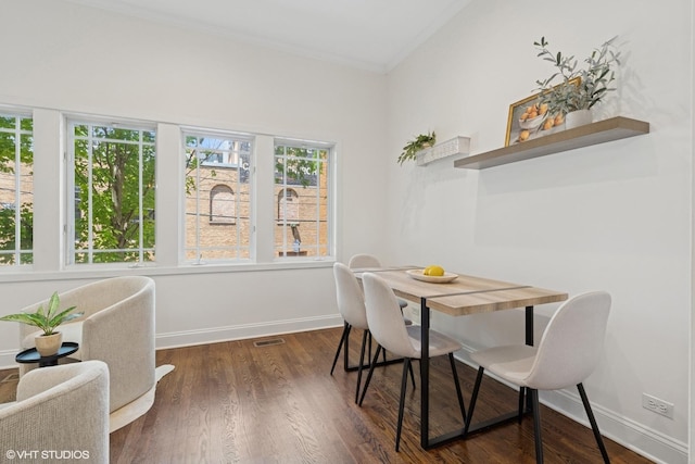 1401 N Wieland St Unit P, Chicago, IL 60610 - dining space featuring ornamental molding and dark wood-style floors