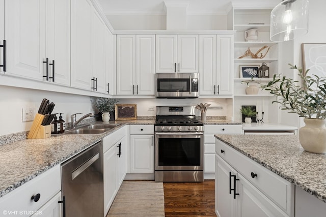 1401 N Wieland St Unit P, Chicago, IL 60610 - kitchen featuring appliances with stainless steel finishes, open shelves, white cabinets, ornamental molding, and dark wood-style floors