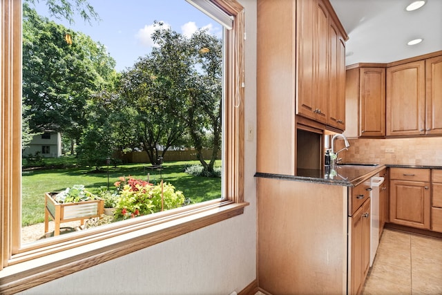 674 Carriage Dr, Batavia, IL 60510 - kitchen with tasteful backsplash, light tile patterned flooring, dark stone counters, stainless steel dishwasher, and recessed lighting
