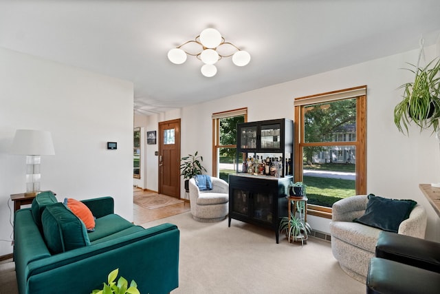 674 Carriage Dr, Batavia, IL 60510 - living area with healthy amount of natural light, carpet flooring, and a bar