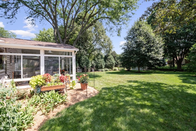 674 Carriage Dr, Batavia, IL 60510 - view of green lawn with a sunroom and a vegetable garden