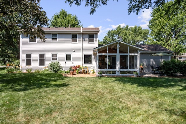674 Carriage Dr, Batavia, IL 60510 - back of house with a yard and a sunroom