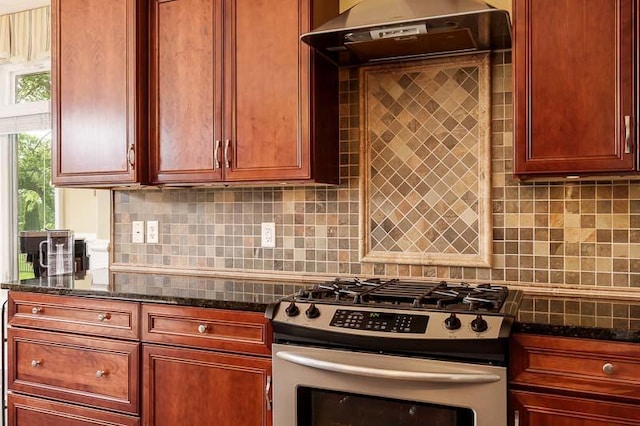 12499 Ayrshire Ln, Loves Park, IL 61111 - kitchen with gas range, ventilation hood, reddish brown cabinets, backsplash, and dark stone counters