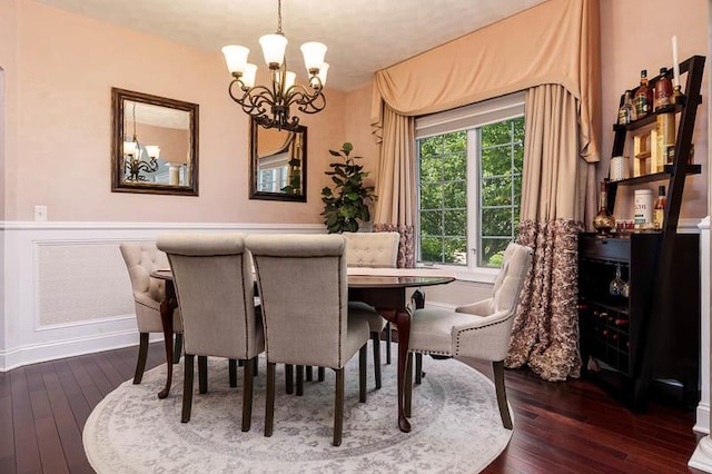 12499 Ayrshire Ln, Loves Park, IL 61111 - dining room with a chandelier and dark wood finished floors