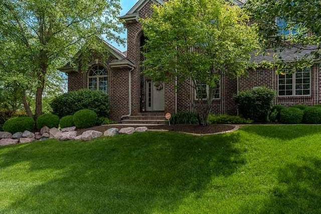 12499 Ayrshire Ln, Loves Park, IL 61111 - view of front of house with a front yard and brick siding