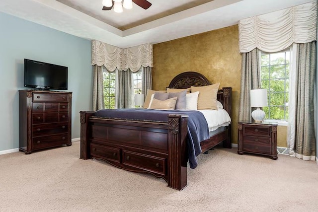 12499 Ayrshire Ln, Loves Park, IL 61111 - bedroom featuring carpet floors, multiple windows, and a tray ceiling