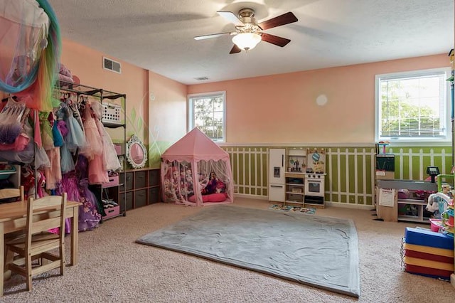 12499 Ayrshire Ln, Loves Park, IL 61111 - game room featuring a ceiling fan, carpet floors, and a textured ceiling