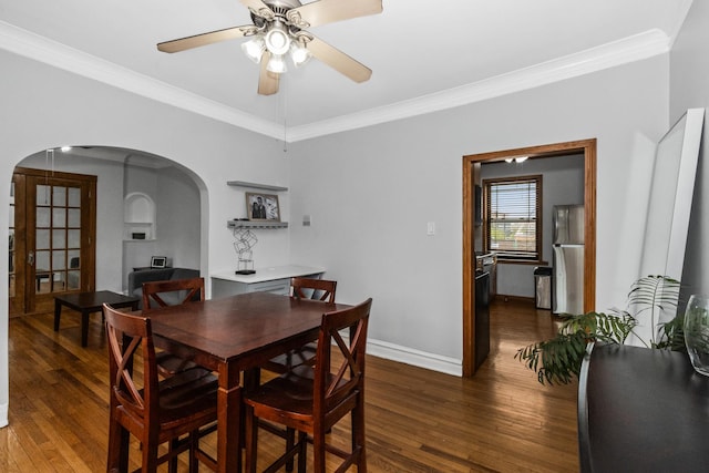 510 Madison St Unit 3S, Oak Park, IL 60302 - dining area featuring arched walkways, wood finished floors, ornamental molding, and a ceiling fan