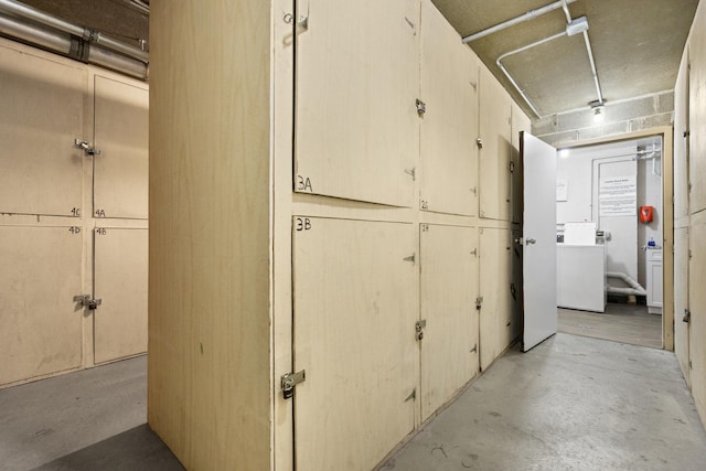 1150 E Jackson St Unit 1A, Lombard, IL 60148 - corridor featuring unfinished concrete flooring and washer / dryer