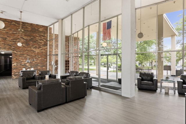 1150 E Jackson St Unit 1A, Lombard, IL 60148 - lobby featuring a towering ceiling, floor to ceiling windows, and brick wall