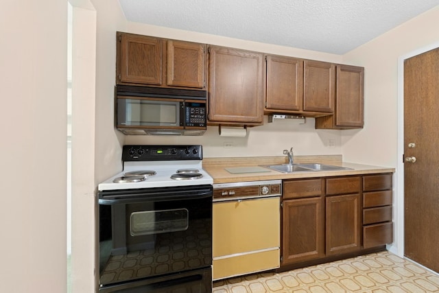 1150 E Jackson St Unit 1A, Lombard, IL 60148 - kitchen with range with electric cooktop, black microwave, dishwasher, light countertops, and a textured ceiling