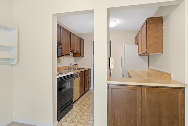 1150 E Jackson St Unit 1A, Lombard, IL 60148 - kitchen featuring black appliances, light countertops, and light flooring