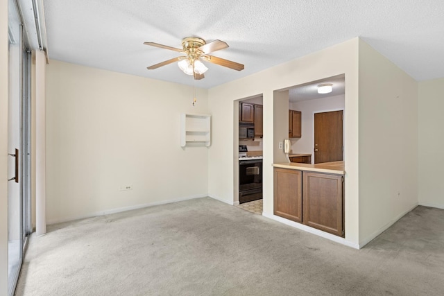 1150 E Jackson St Unit 1A, Lombard, IL 60148 - unfurnished living room featuring light carpet, a ceiling fan, and a textured ceiling