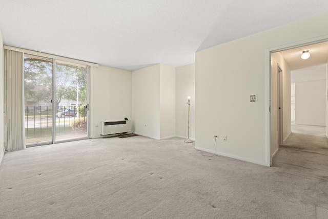 1150 E Jackson St Unit 1A, Lombard, IL 60148 - unfurnished living room with carpet floors and heating unit