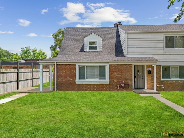 9509 S Merrion Ave, Chicago, IL 60617 - view of front of home with brick siding, a chimney, and a shingled roof