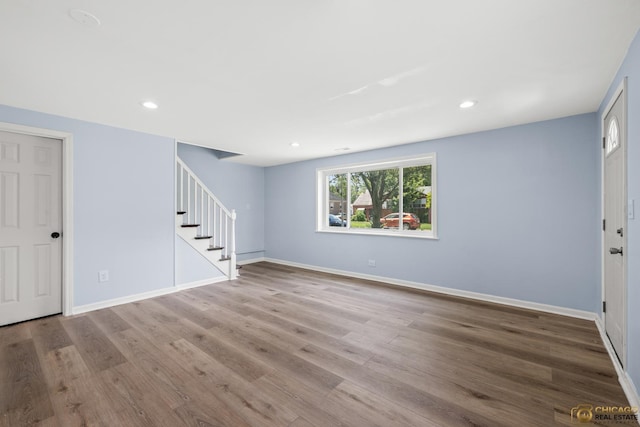 9509 S Merrion Ave, Chicago, IL 60617 - unfurnished living room featuring stairway, wood finished floors, and recessed lighting