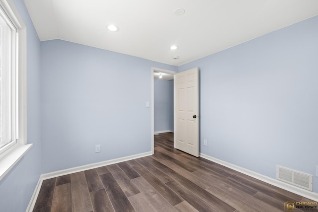 9509 S Merrion Ave, Chicago, IL 60617 - unfurnished room with dark wood finished floors, recessed lighting, and vaulted ceiling