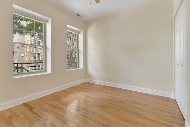 3415 W Berteau Ave Unit 1, Chicago, IL 60618 - unfurnished room featuring light wood-style floors and a ceiling fan