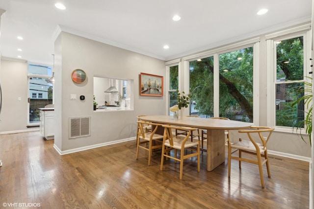1212 W School St, Chicago, IL 60657 - dining area with ornamental molding, healthy amount of natural light, wood finished floors, and recessed lighting