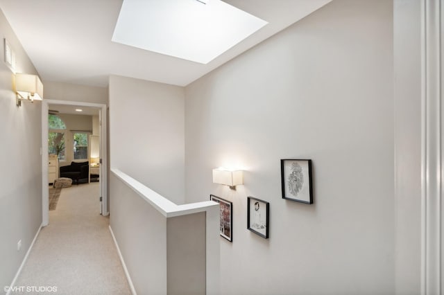 1212 W School St, Chicago, IL 60657 - hall featuring a skylight, an upstairs landing, and light carpet