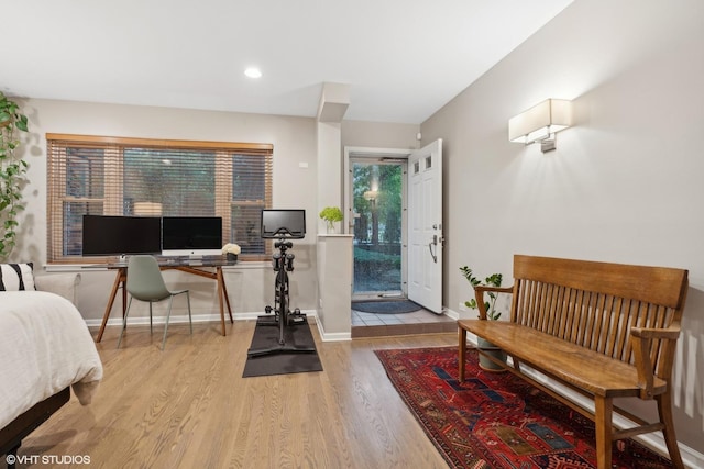 1212 W School St, Chicago, IL 60657 - bedroom with wood finished floors, a desk, and recessed lighting