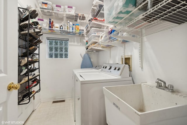 1212 W School St, Chicago, IL 60657 - washroom with washing machine and clothes dryer and baseboards