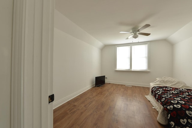 422 Sibley Blvd, Calumet City, IL 60409 - bedroom featuring vaulted ceiling, wood finished floors, and a ceiling fan