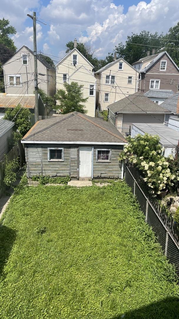 4838 S Bishop St, Chicago, IL 60609 - back of house with roof with shingles