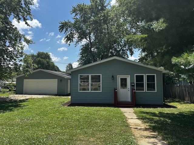 207 W 2nd St, Streator, IL 61364 - view of front of house with a garage, an outbuilding, and entry steps