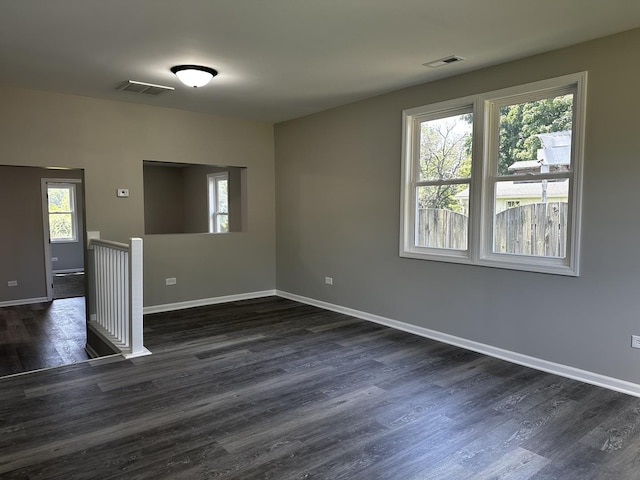 207 W 2nd St, Streator, IL 61364 - unfurnished room with dark wood finished floors and baseboards