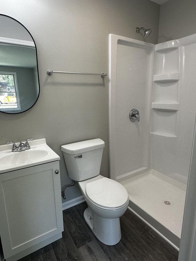 207 W 2nd St, Streator, IL 61364 - bathroom with wood finished floors, a shower stall, and vanity
