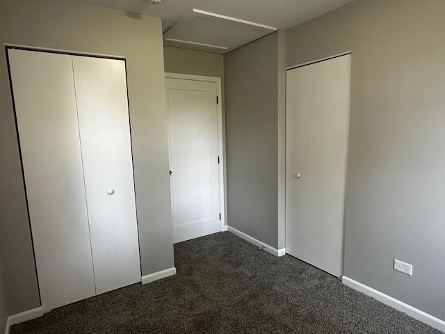 207 W 2nd St, Streator, IL 61364 - unfurnished bedroom featuring dark colored carpet and attic access