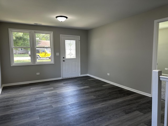 207 W 2nd St, Streator, IL 61364 - entryway with dark wood-type flooring and baseboards