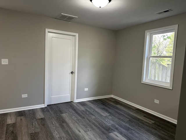 207 W 2nd St, Streator, IL 61364 - unfurnished room featuring dark wood-type flooring and baseboards