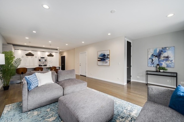 927 N Damen Ave Unit 2, Chicago, IL 60622 - living room featuring wood finished floors and recessed lighting
