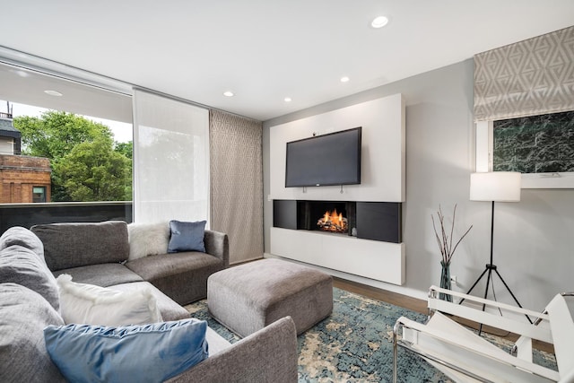 927 N Damen Ave Unit 2, Chicago, IL 60622 - living area featuring wood finished floors, recessed lighting, and a warm lit fireplace