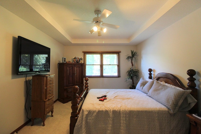 396 W 8th St, Manteno, IL 60950 - bedroom featuring light carpet, a raised ceiling, and a ceiling fan