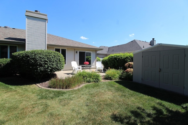 396 W 8th St, Manteno, IL 60950 - view of grassy yard with a shed and a patio area