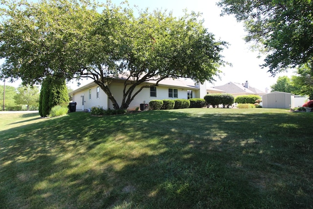 396 W 8th St, Manteno, IL 60950 - view of green lawn featuring a storage unit