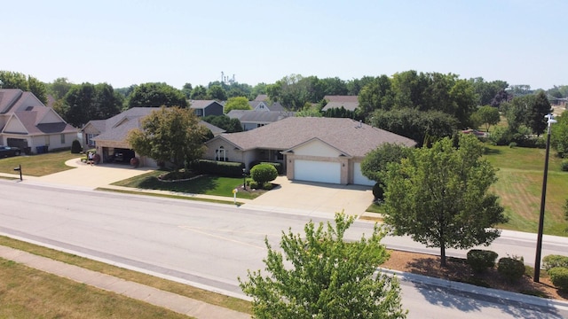 396 W 8th St, Manteno, IL 60950 - view of front of home with concrete driveway, a garage, a residential view, and a front lawn
