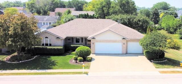 396 W 8th St, Manteno, IL 60950 - view of front of house with a garage, driveway, brick siding, a front lawn, and roof with shingles