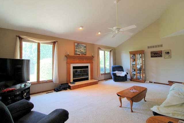 396 W 8th St, Manteno, IL 60950 - carpeted living area with a glass covered fireplace, ceiling fan, and high vaulted ceiling