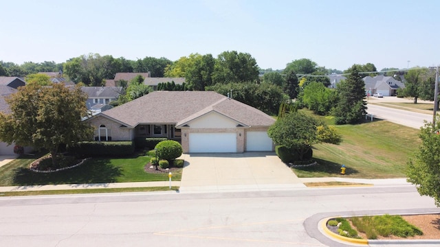 396 W 8th St, Manteno, IL 60950 - view of front facade with driveway, a garage, and a front yard