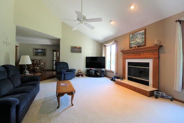 396 W 8th St, Manteno, IL 60950 - carpeted living room with a ceiling fan, a glass covered fireplace, and high vaulted ceiling