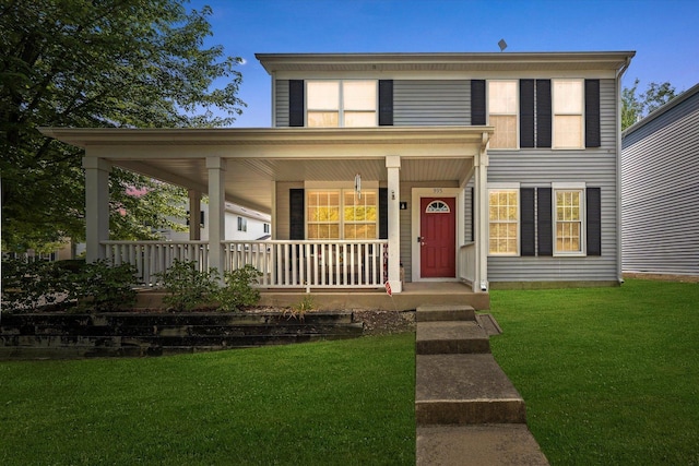 995 Serendipity Dr, Aurora, IL 60504 - view of front of property with covered porch and a front yard