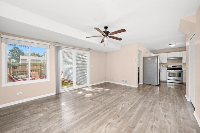 995 Serendipity Dr, Aurora, IL 60504 - unfurnished living room with ceiling fan and light wood-style flooring